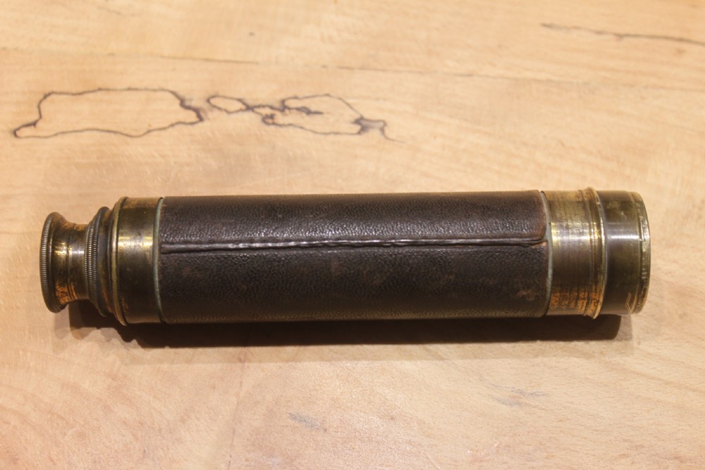 A brass pocket telescope by C Barrett, London View V