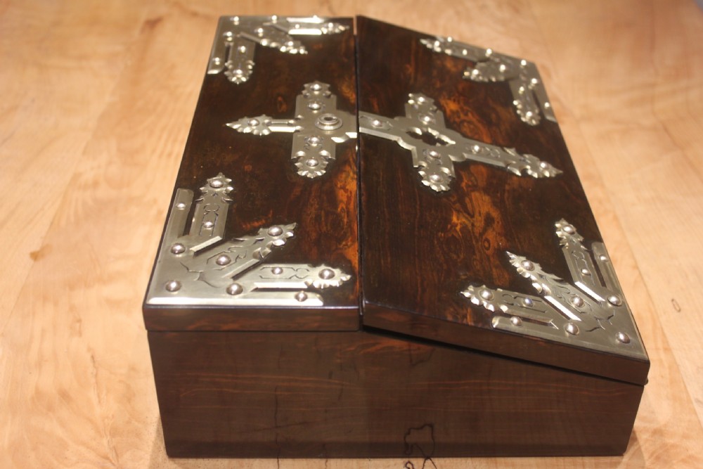 A rectangular dark coromandel wood writing slope box decorated with ornate Gothic Revival brass corner mounts and central brass straps. View III