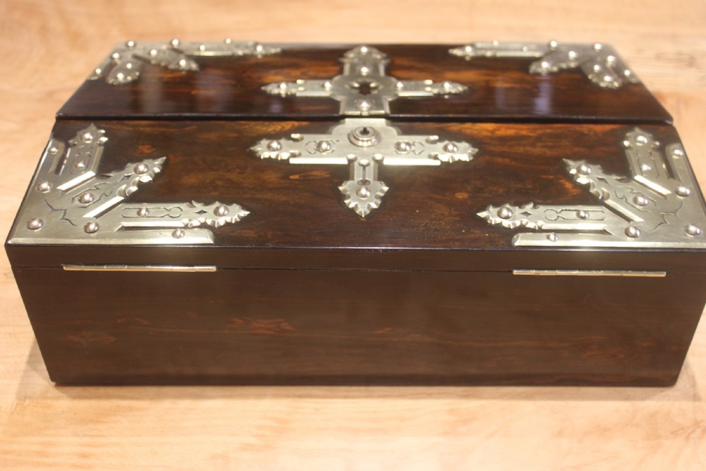 A rectangular dark coromandel wood writing slope box decorated with ornate Gothic Revival brass corner mounts and central brass straps. View IV
