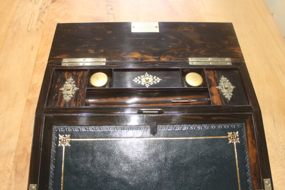A rectangular dark coromandel wood writing slope box decorated with ornate Gothic Revival brass corner mounts and central brass straps. View VII