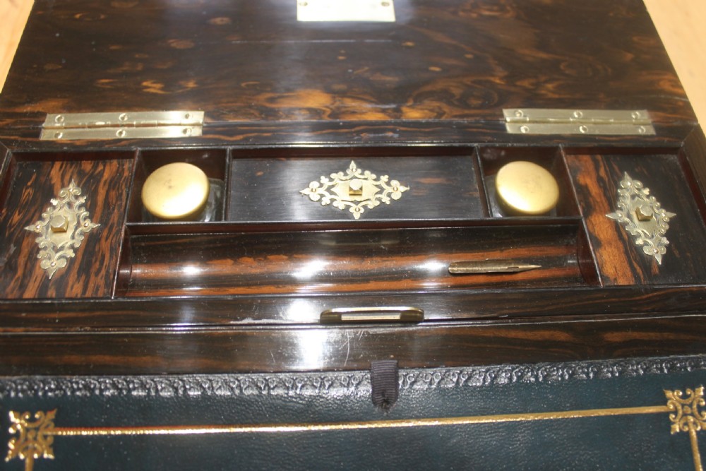 A rectangular dark coromandel wood writing slope box decorated with ornate Gothic Revival brass corner mounts and central brass straps. View VIII