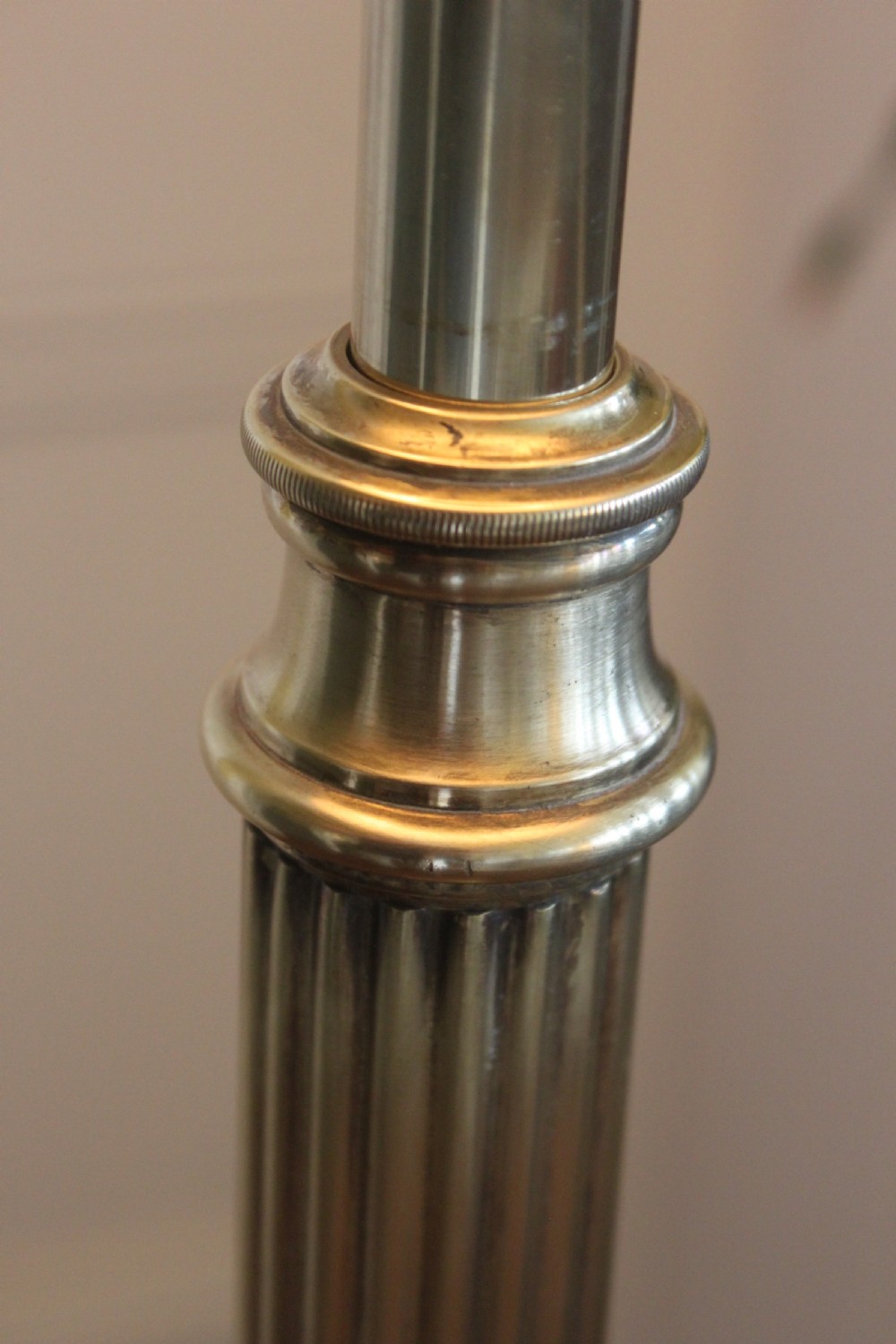 A tall Victorian brass telescopic standard lamp featuring a reeded column, gadrooned base, and a pleated fabric lampshade. View VIII