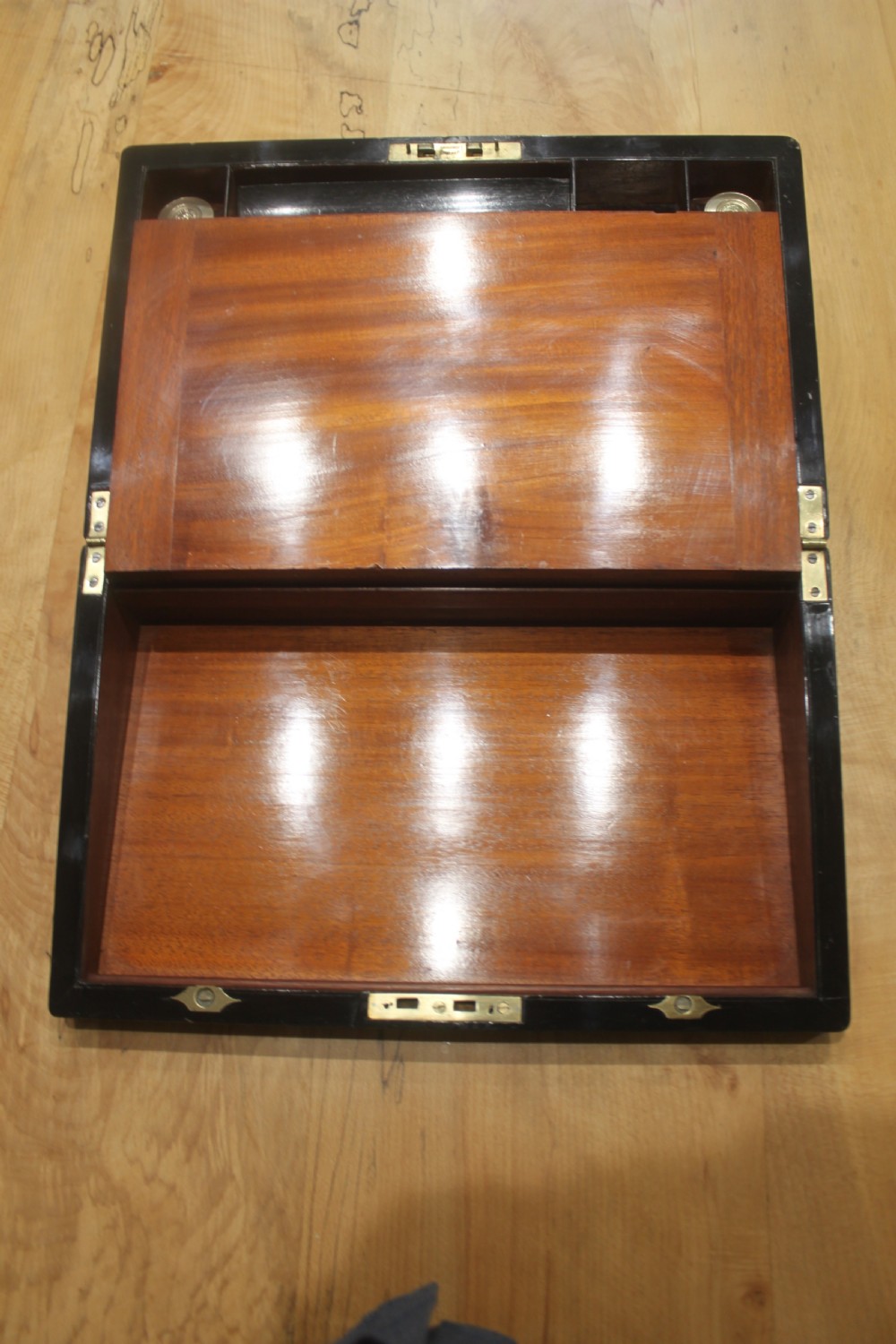 A rectangular antique burr walnut writing slope with an inlaid central cartouche and a brass circular Bramah lock on the front face. View XI