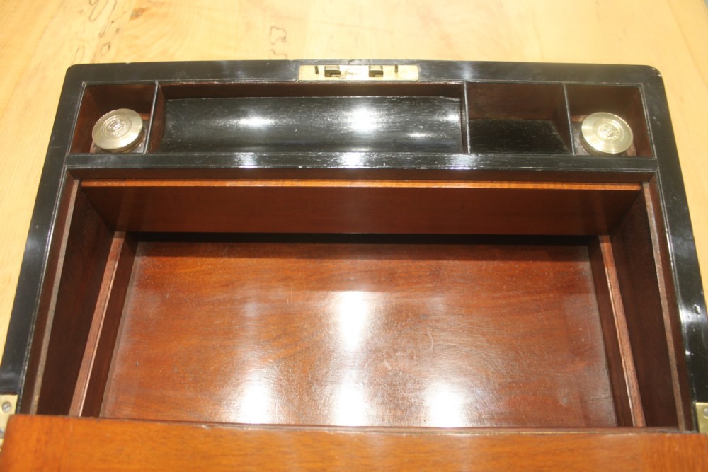 A rectangular antique burr walnut writing slope with an inlaid central cartouche and a brass circular Bramah lock on the front face. View XIII