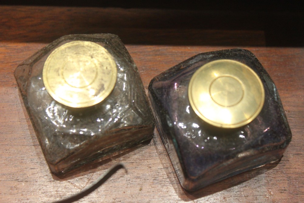 A rectangular dark rosewood box decorated with intricate brass scrollwork inlay along the borders and top centre, complete with a key inserted into the front lock. View XIII