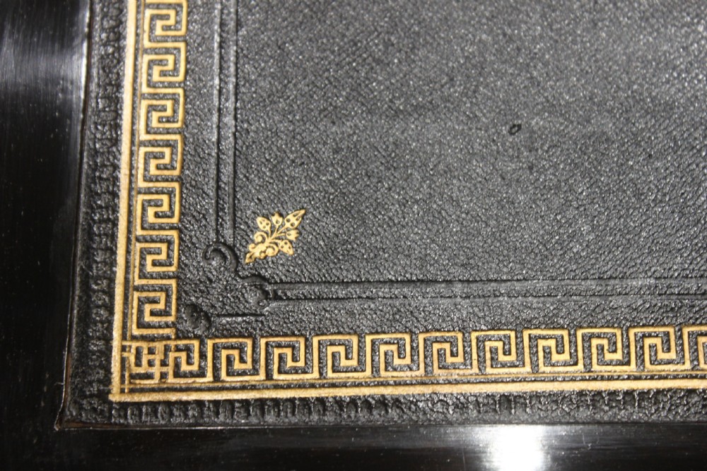 A dark walnut rectangular writing slope with brass edge binding, an inset brass plaque on top, and a brass escutcheon with key. View VI