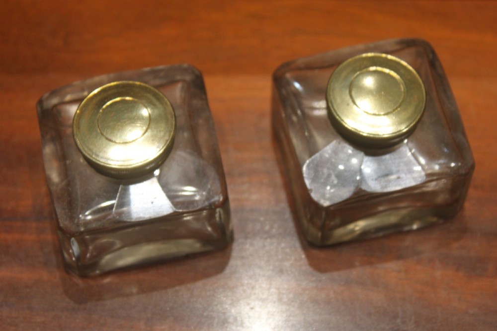 A dark walnut rectangular writing slope with brass edge binding, an inset brass plaque on top, and a brass escutcheon with key. View X
