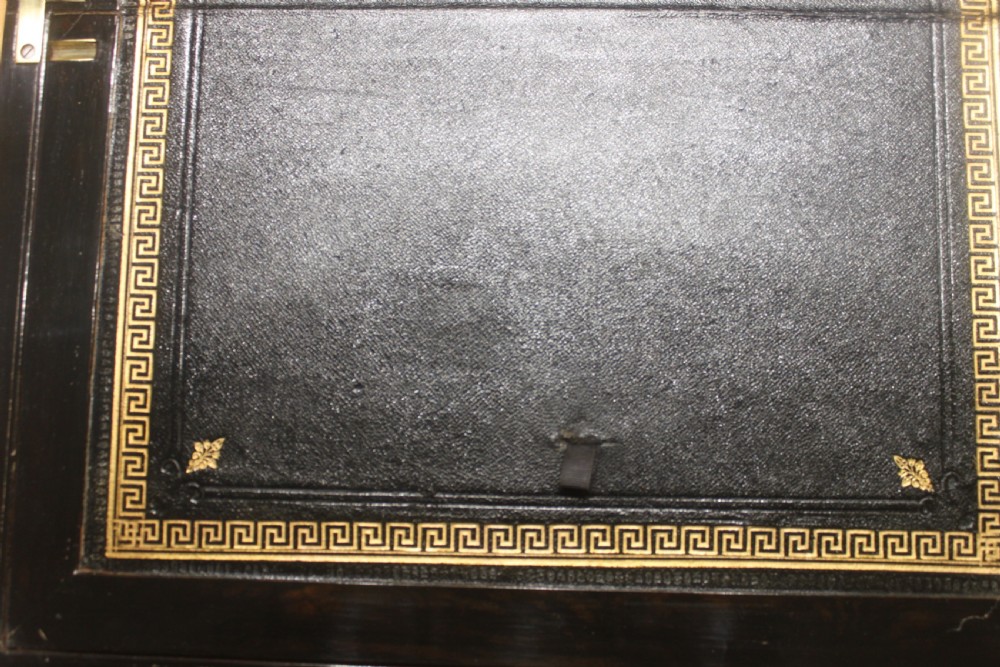 A dark walnut rectangular writing slope with brass edge binding, an inset brass plaque on top, and a brass escutcheon with key. View XIV