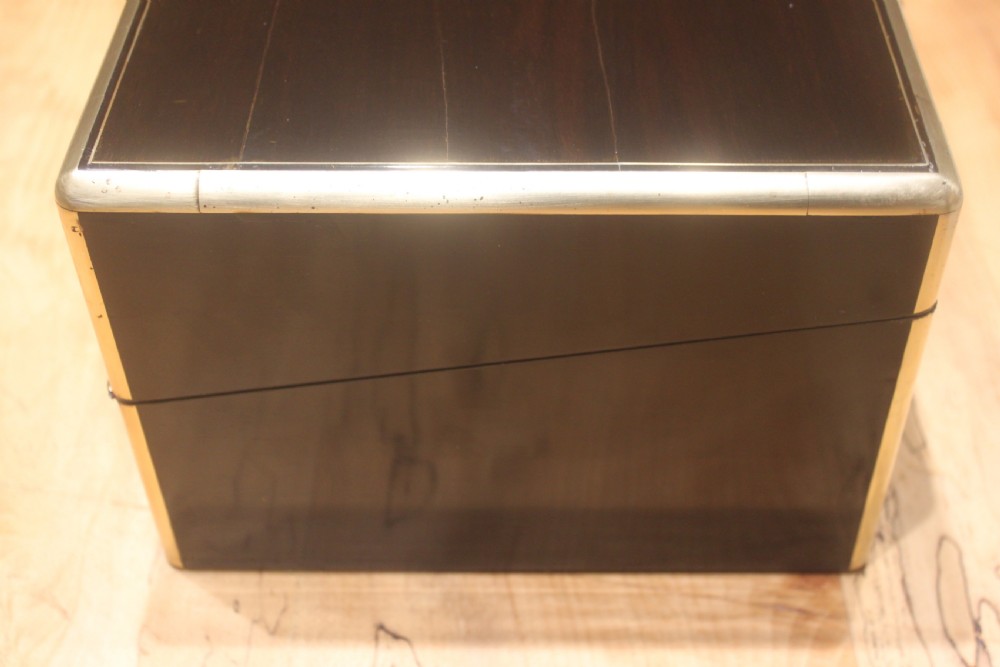A quality late 19th century Coromandel and brass bound writing slope View II