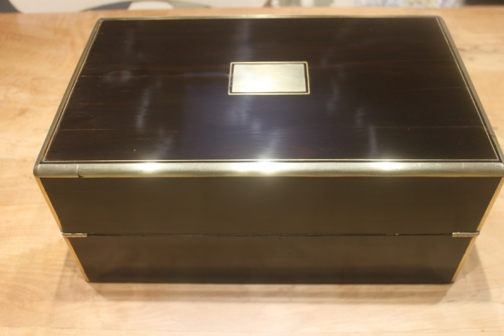 A quality late 19th century Coromandel and brass bound writing slope View III