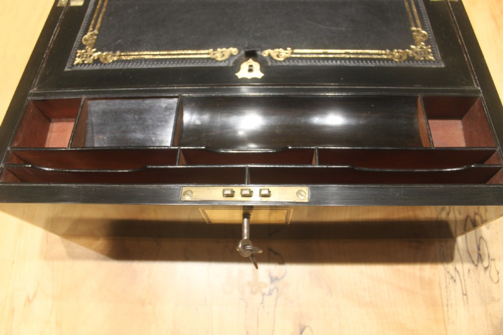A quality late 19th century Coromandel and brass bound writing slope View IX