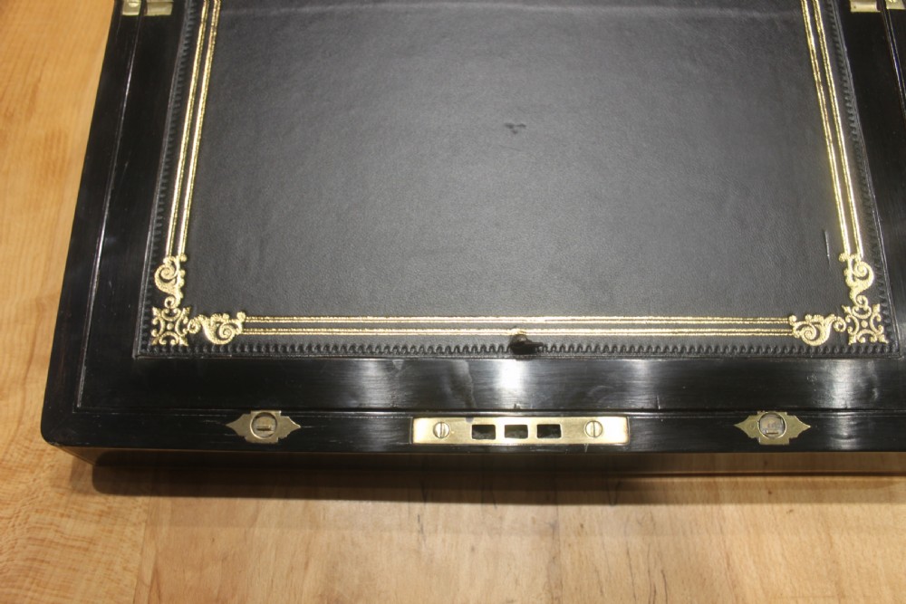 A quality late 19th century Coromandel and brass bound writing slope View X