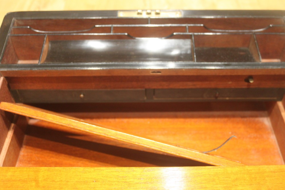A quality late 19th century Coromandel and brass bound writing slope View XIII