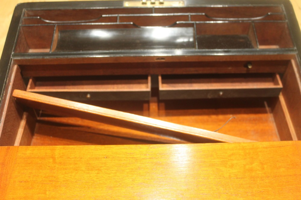 A quality late 19th century Coromandel and brass bound writing slope View XIV
