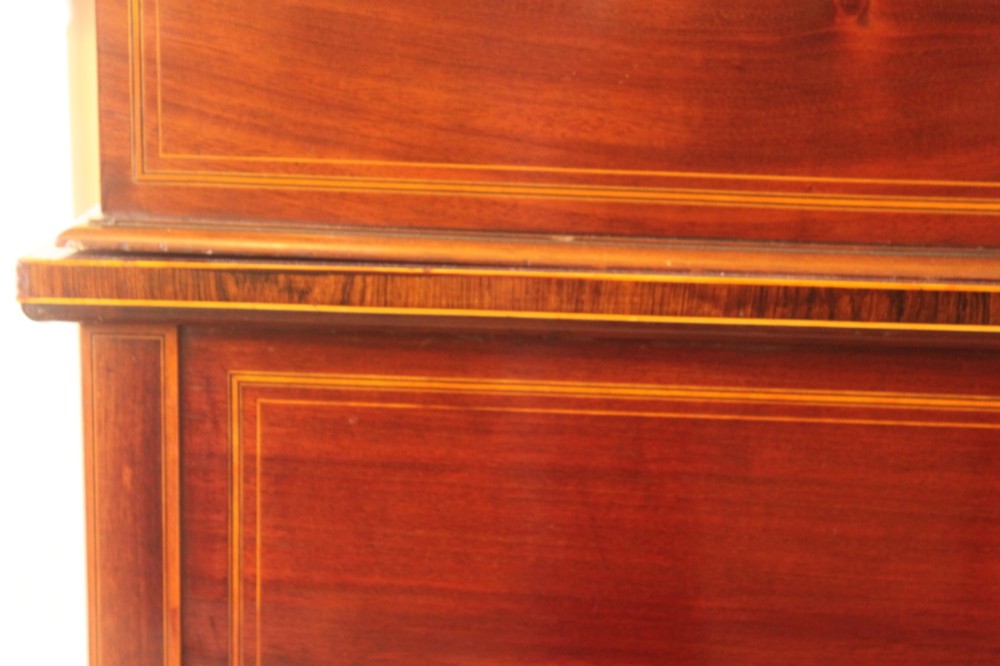 A Sheraton Revival mahogany writing desk featuring intricate marquetry inlays, a brown leather writing surface, a raised superstructure with small drawers, and square tapered legs. View XIV