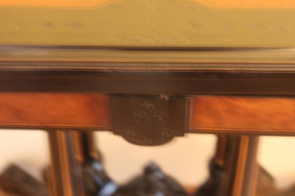 A Victorian foldover card table featuring a burr walnut top, ebonised border, double twin-column pedestal, and carved legs with castors. View III