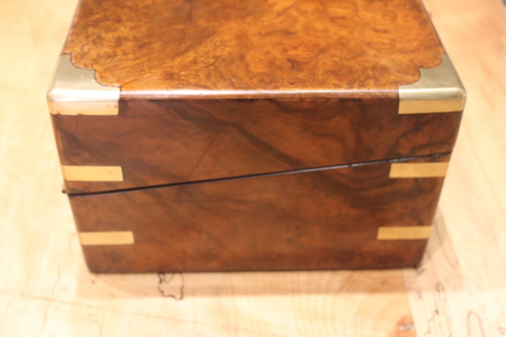 A Victorian burr walnut writing slope with secret drawers View II