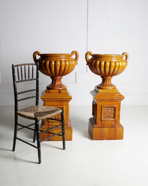 large ochre glazed majolica urns on plinths - CATEGORY: ANTIQUE CERAMICS - DATED VICTORIAN
