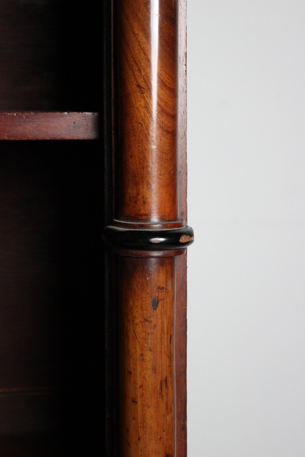 A large 19th-century double-bay open timber bookcase with arched tops and turned column pilasters in a warm brown finish. View IX