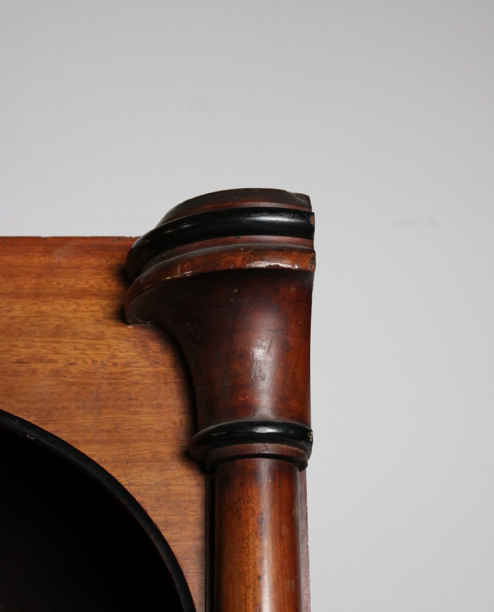 A large 19th-century double-bay open timber bookcase with arched tops and turned column pilasters in a warm brown finish. View X