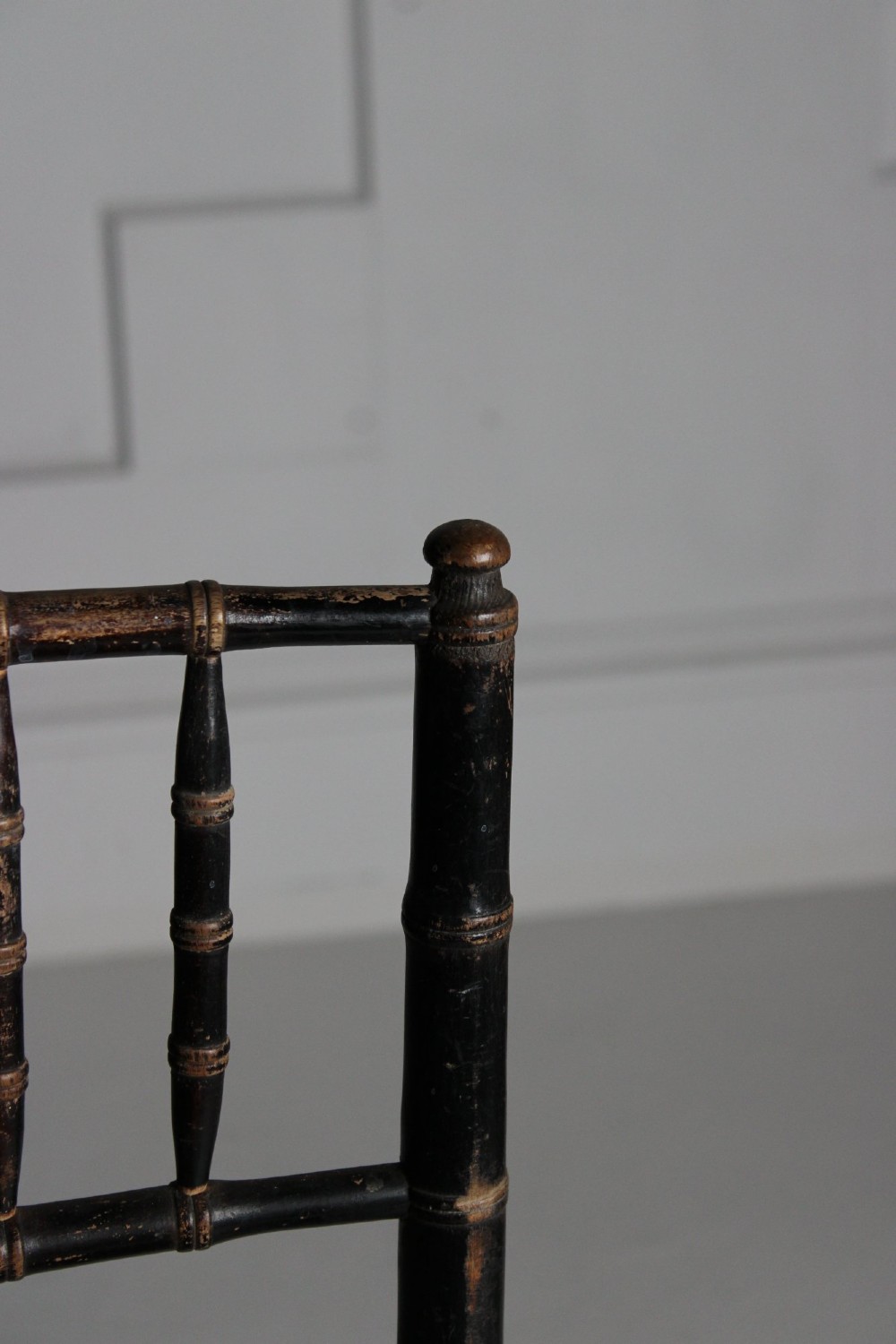 A late 19th-century ebonised side chair featuring turned faux bamboo detailing and a woven rush seat. View VI
