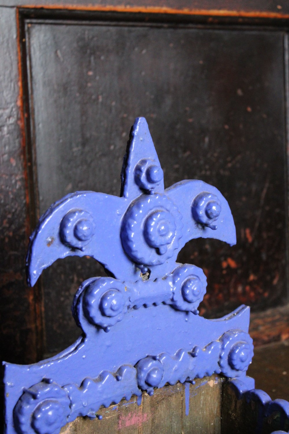 A pair of notch-carved wooden tramp art wall boxes painted in vivid blue with geometric chip-carved layers and crown pediments. View IV