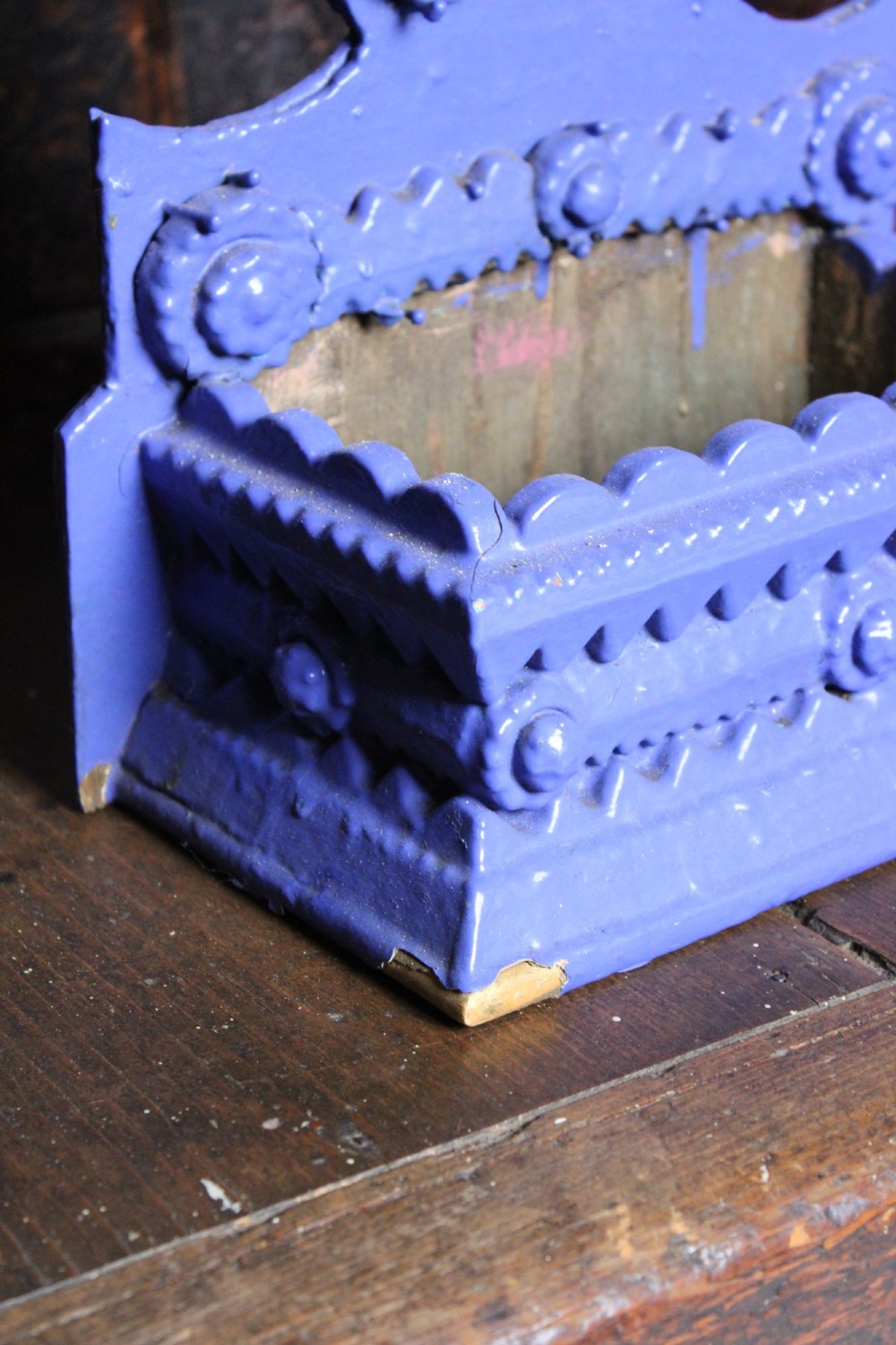 A pair of notch-carved wooden tramp art wall boxes painted in vivid blue with geometric chip-carved layers and crown pediments. View V