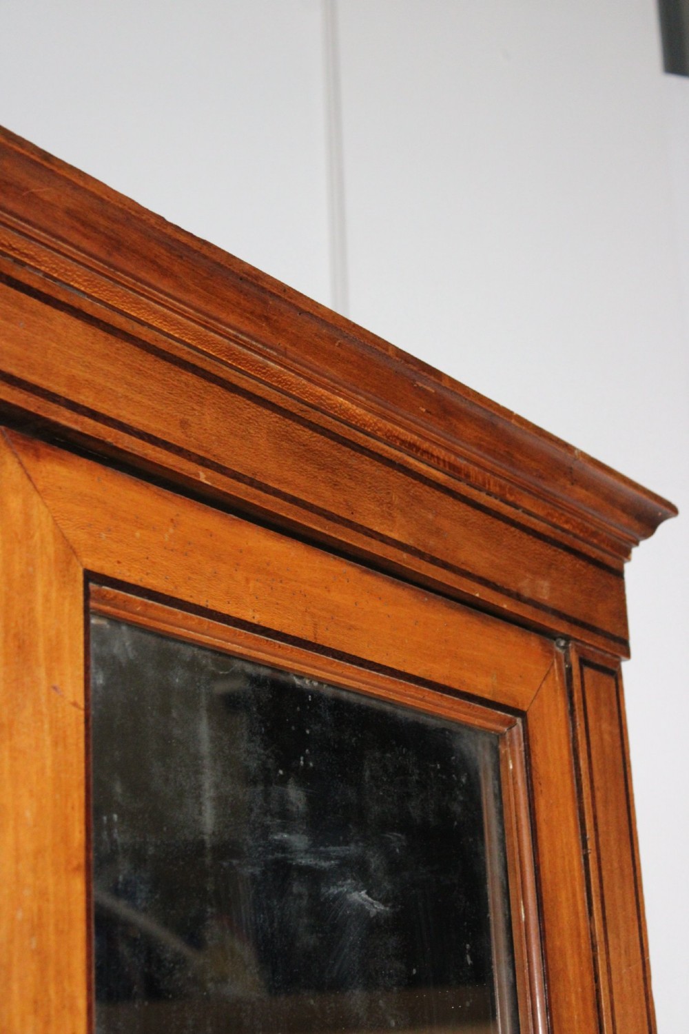 A tall 19th-century fruitwood secretaire cabinet featuring a glazed double-door upper section, a fall-front writing flap, and three long drawers below. View V