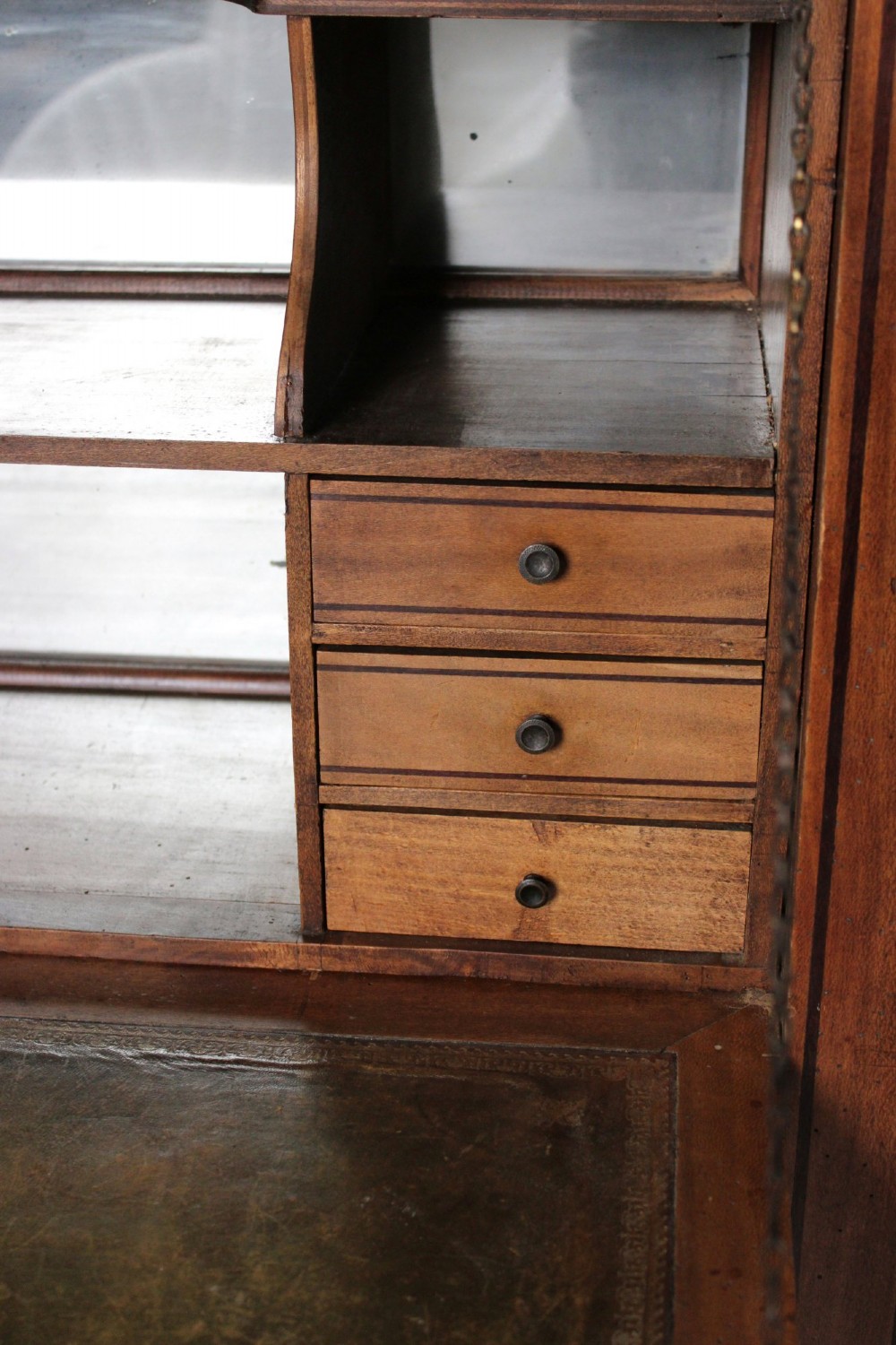 A tall 19th-century fruitwood secretaire cabinet featuring a glazed double-door upper section, a fall-front writing flap, and three long drawers below. View VI