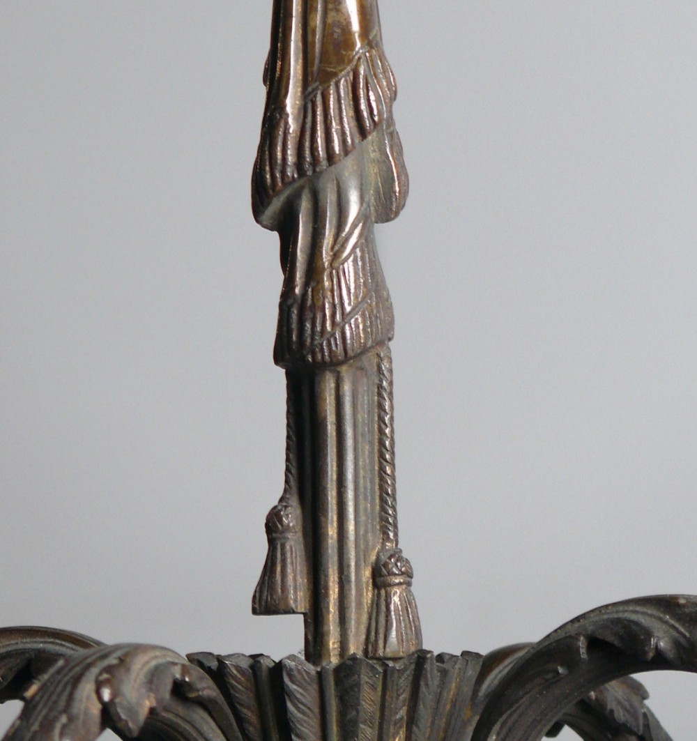 A 19th-century French dark bronze four-arm candle chandelier with scrolling branches, leaf motifs, and a central fluted column. View III
