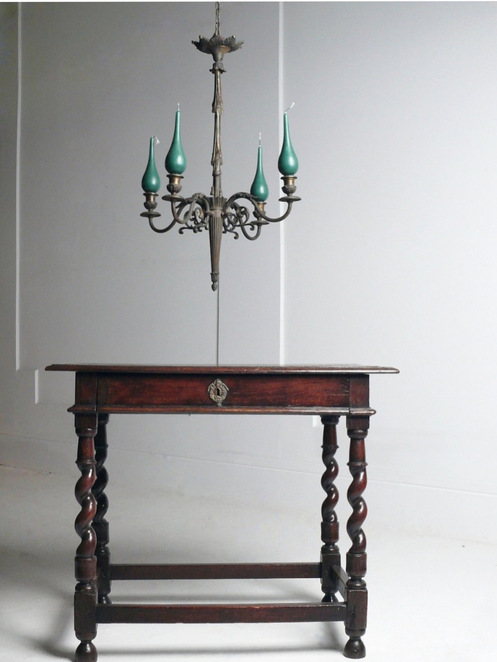 A 19th-century French dark bronze four-arm candle chandelier with scrolling branches, leaf motifs, and a central fluted column. View VI
