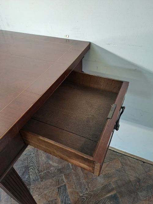 fig 1. A Georgian dark mahogany rectangular console table featuring fluted square tapered legs and subtle top line inlay.