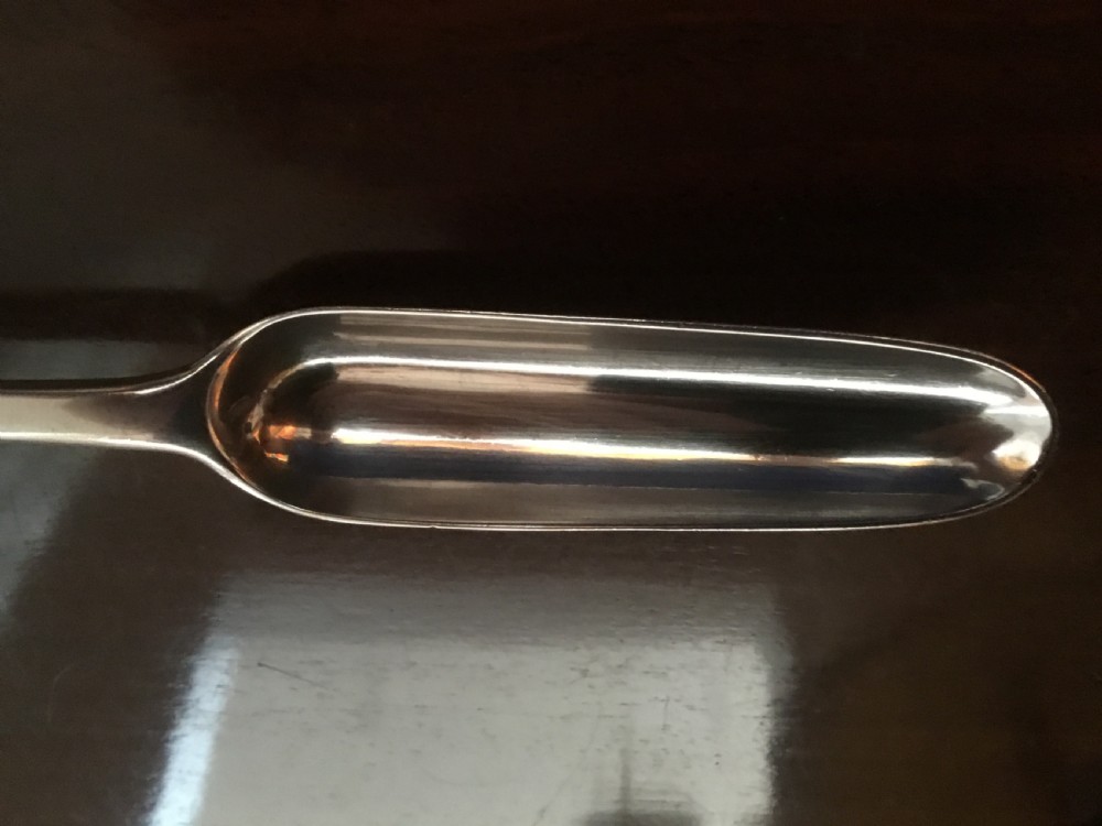 A Georgian double-ended sterling silver marrow scoop featuring a wide elongated trough at one end and a narrower trough stem at the other. View IV