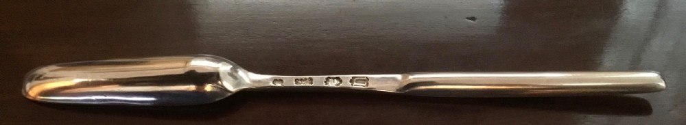 A Georgian double-ended sterling silver marrow scoop featuring a wide elongated trough at one end and a narrower trough stem at the other. View VII