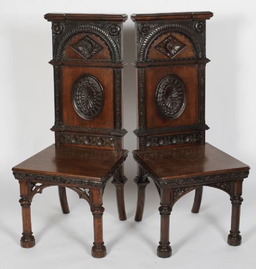 Two C19th Carved Oak Gothic Hall Chairs