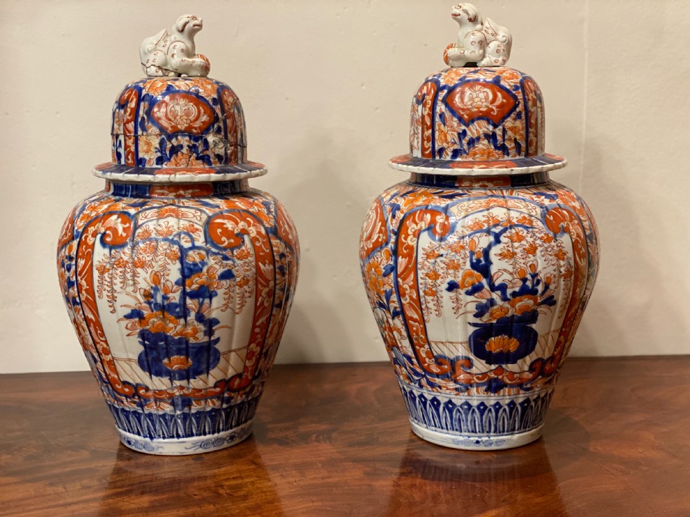 Pair of C19th Imari ovoid jar and covers 
