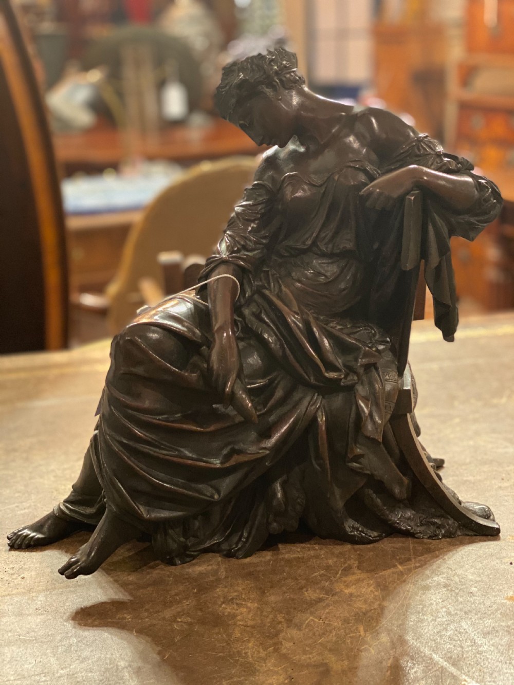 C19th large bronze of classical figure reclining in a chair 