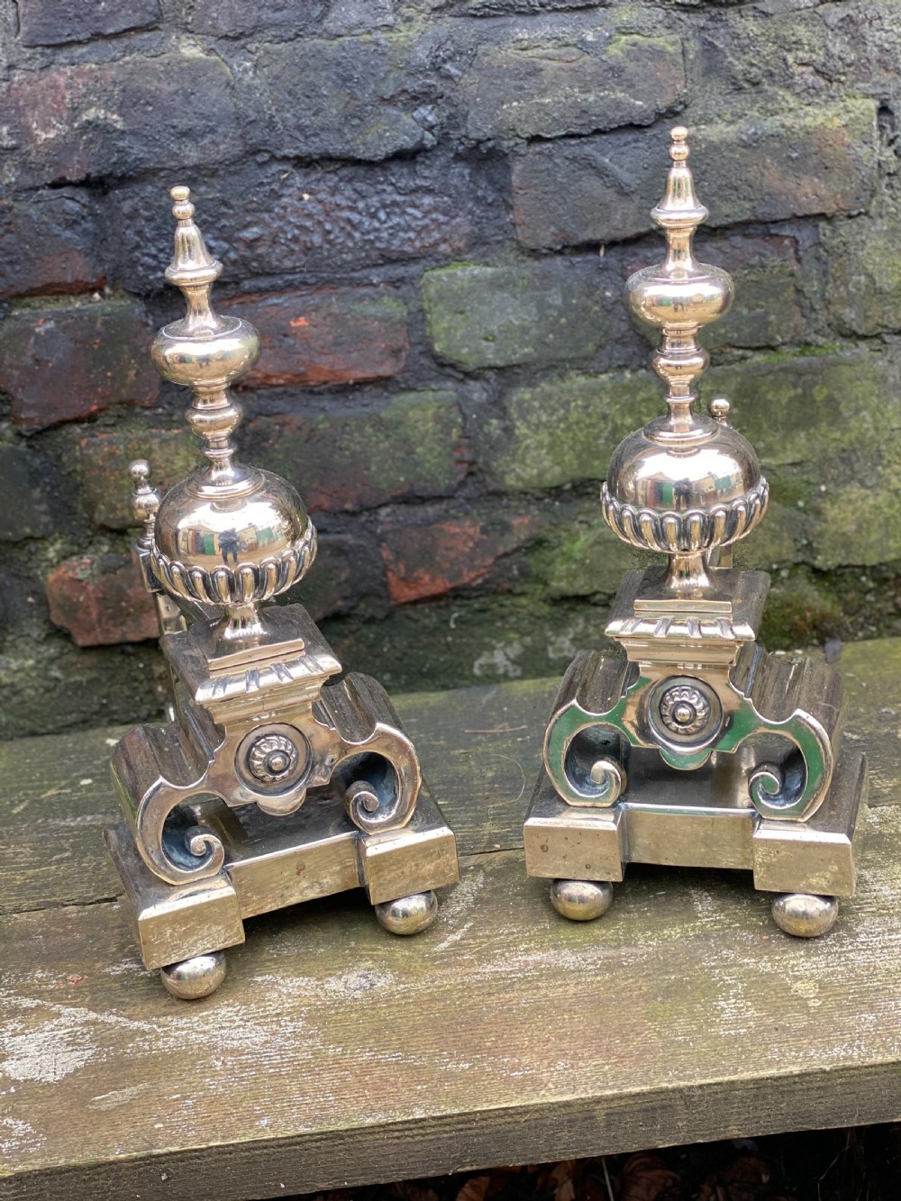 Pair of silver plated brass fire dogs in the C17th style 