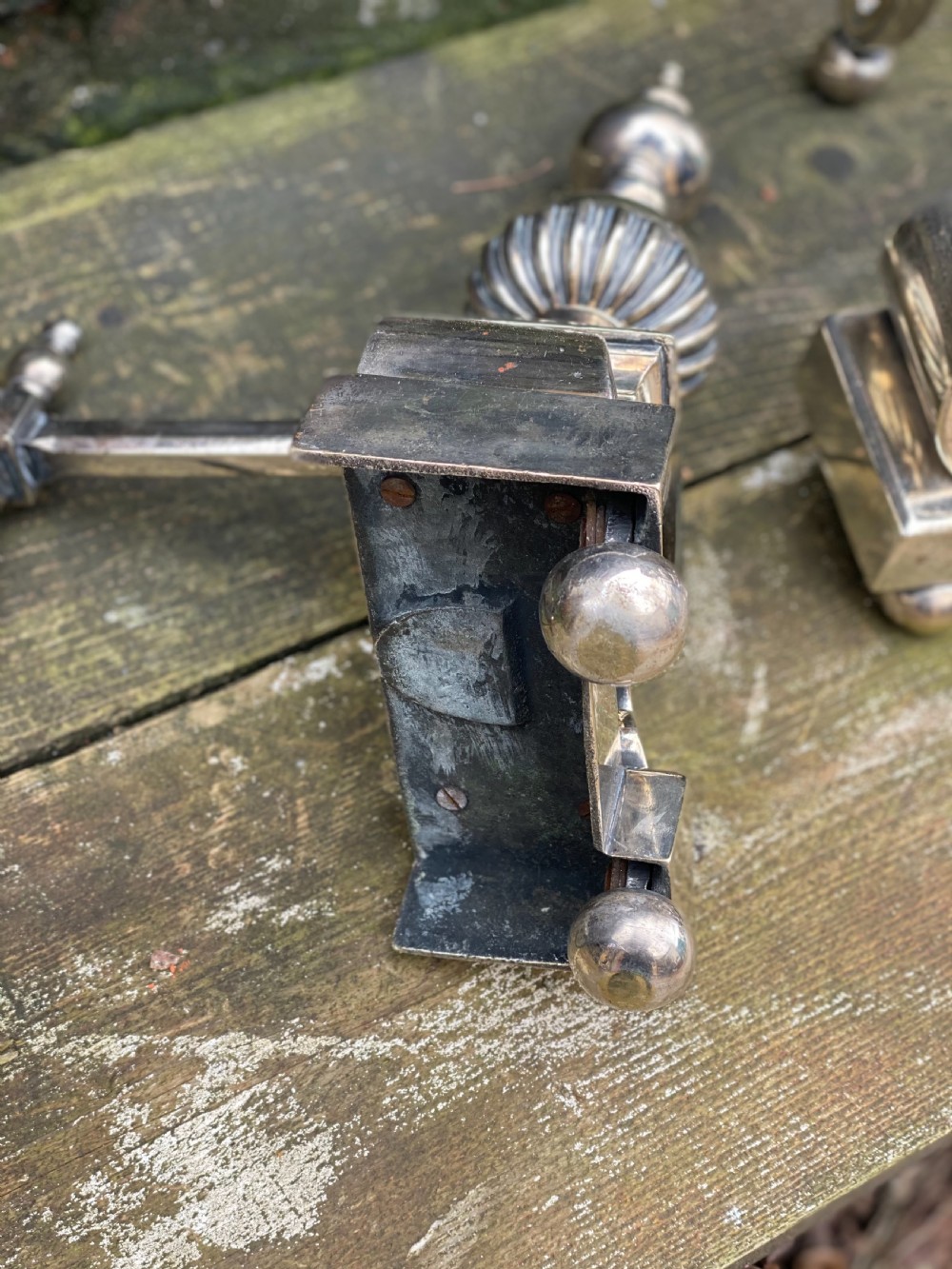 Pair of silver plated brass fire dogs in the C17th style  View V