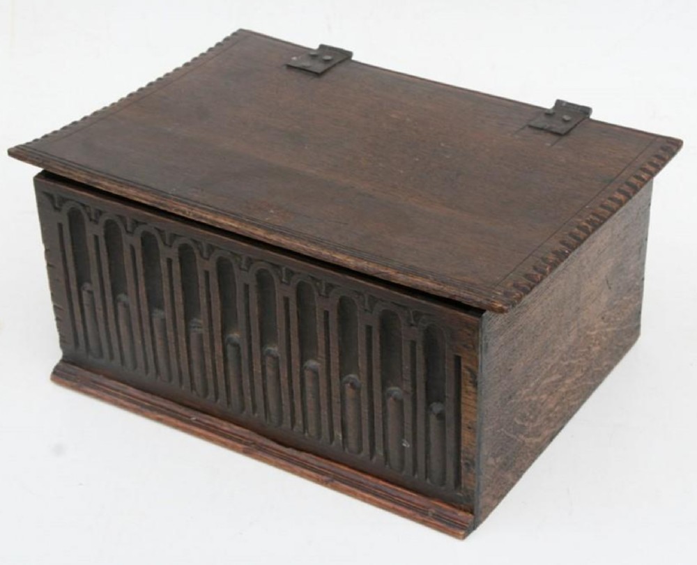 Early C18th oak box with carved front 