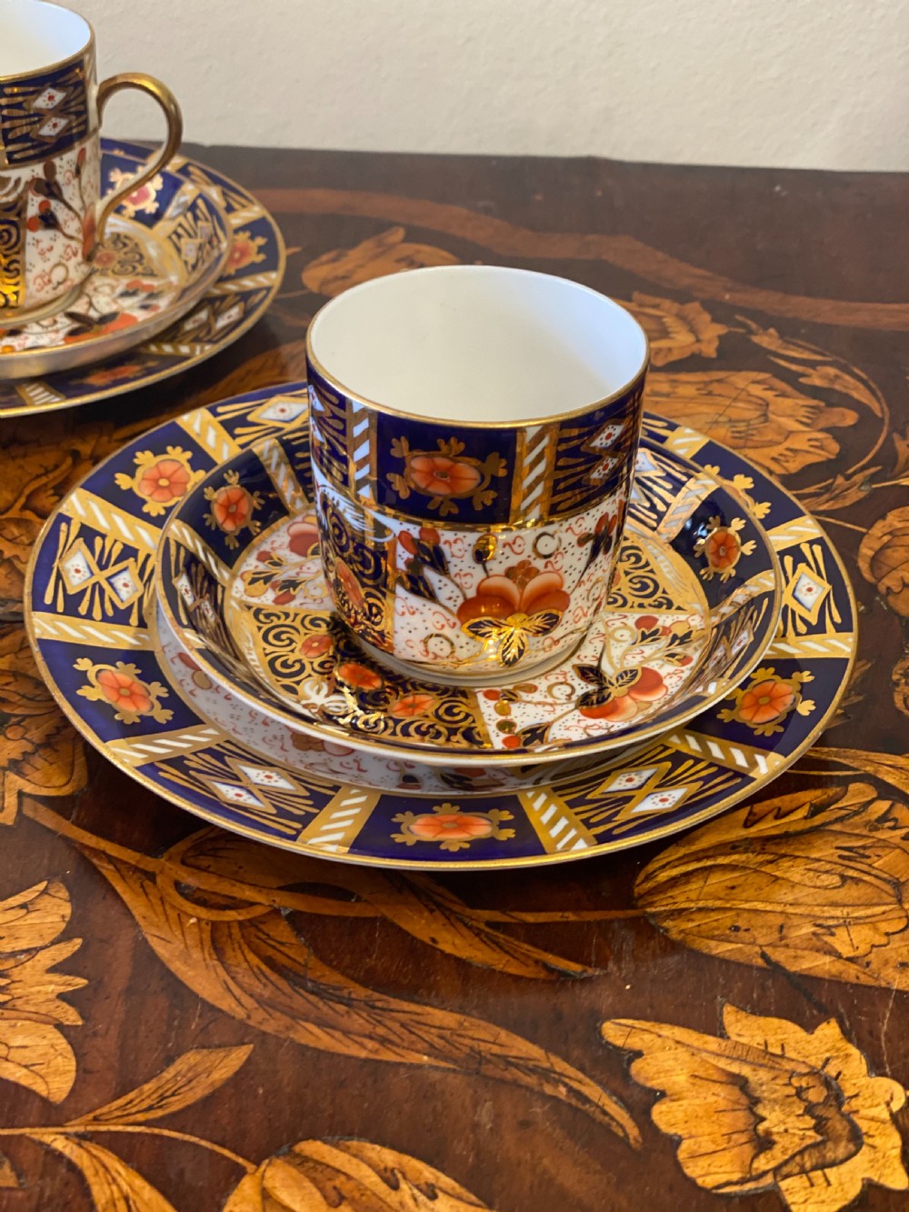 Set of four imari pattern derby style coffee cans and saucers  View II