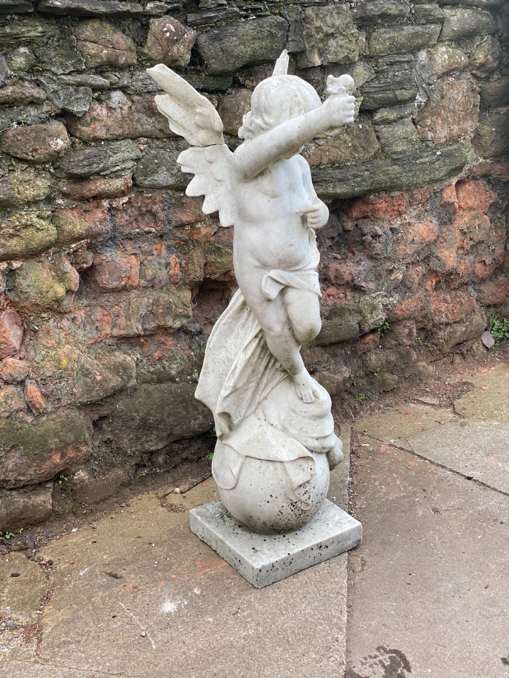 Large marble carved cherub on a ball base  View III