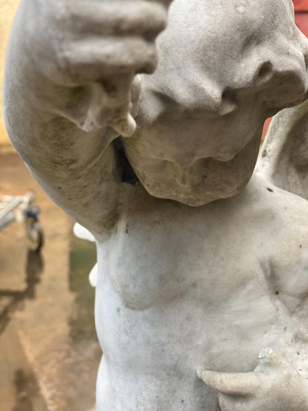 Large marble carved cherub on a ball base  View VIII