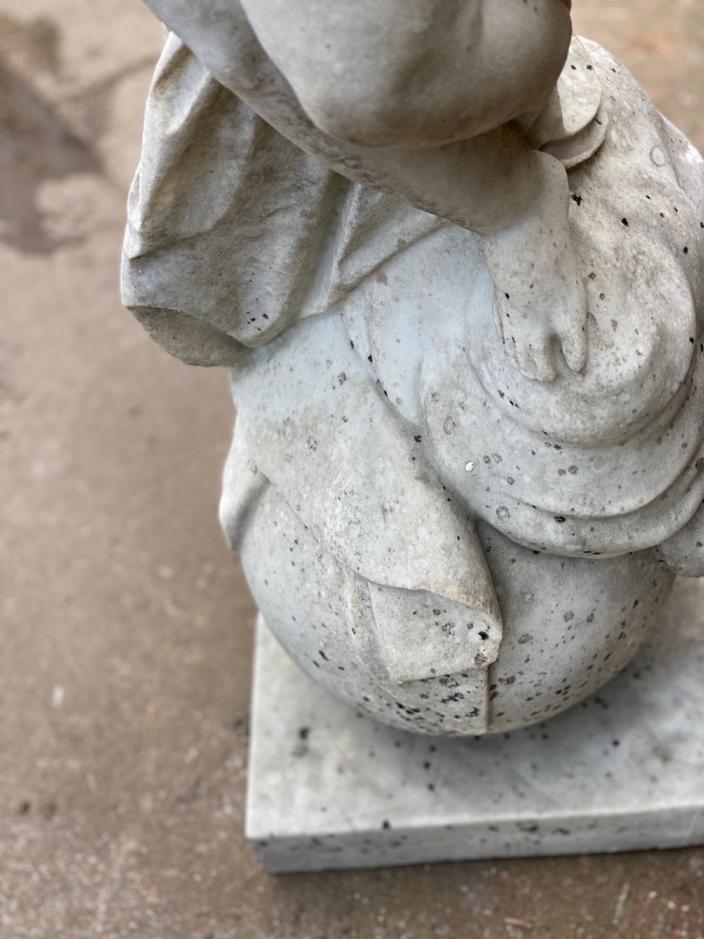 Large marble carved cherub on a ball base  View IX