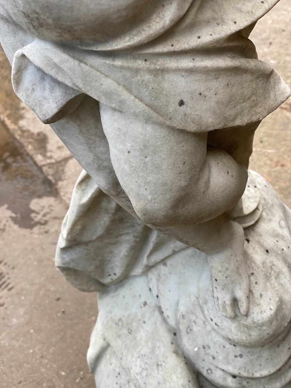 Large marble carved cherub on a ball base  View X