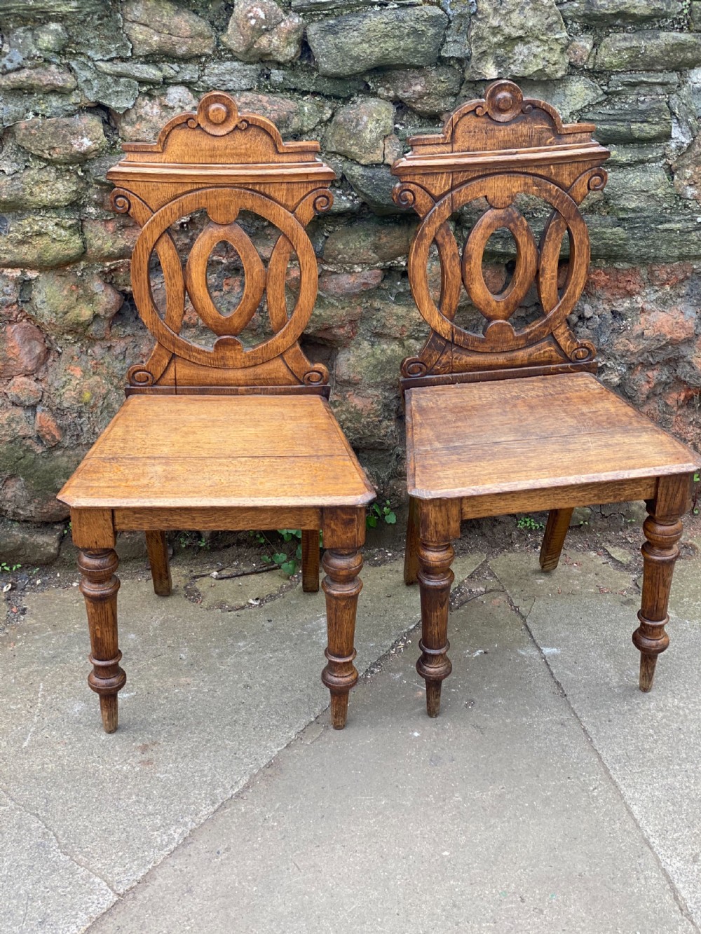 Pair of oak hall chairs with fretwork backs  View II