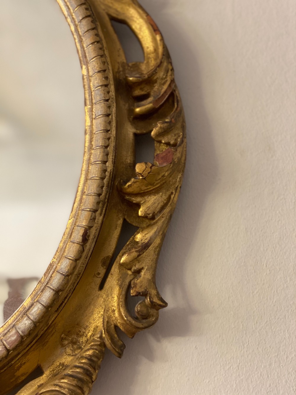 C18th giltwood oval carved mirror  View III