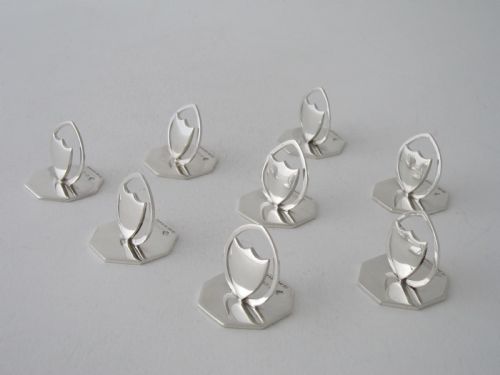 a set of eight antique edwardian sterling silver menuplace card holders - CATEGORY: ANTIQUE SILVER - DATED EDWARDIAN