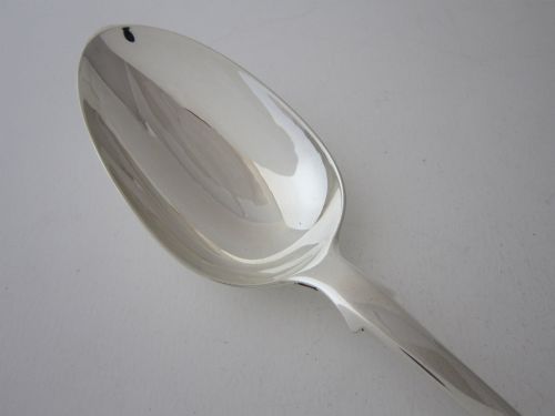 fig 1. An antique Victorian sterling silver basting spoon featuring a classic fiddle pattern handle and a polished oval bowl.