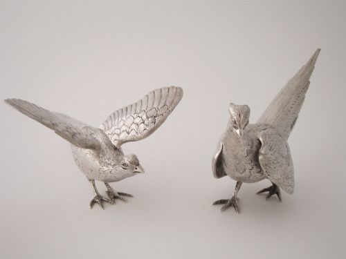 fig 2. A pair of detailed cast sterling silver pheasants portrayed in naturalistic poses against a light background.